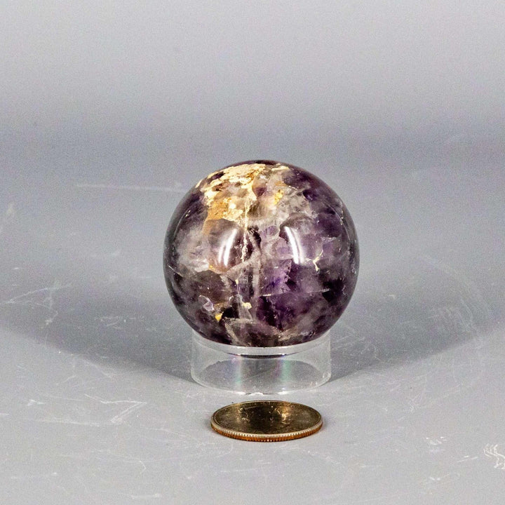 Stunning Amethyst Sphere, 45-72mm, showcasing deep purple hues, natural crystal formations, and polished finish for calm and clarity.