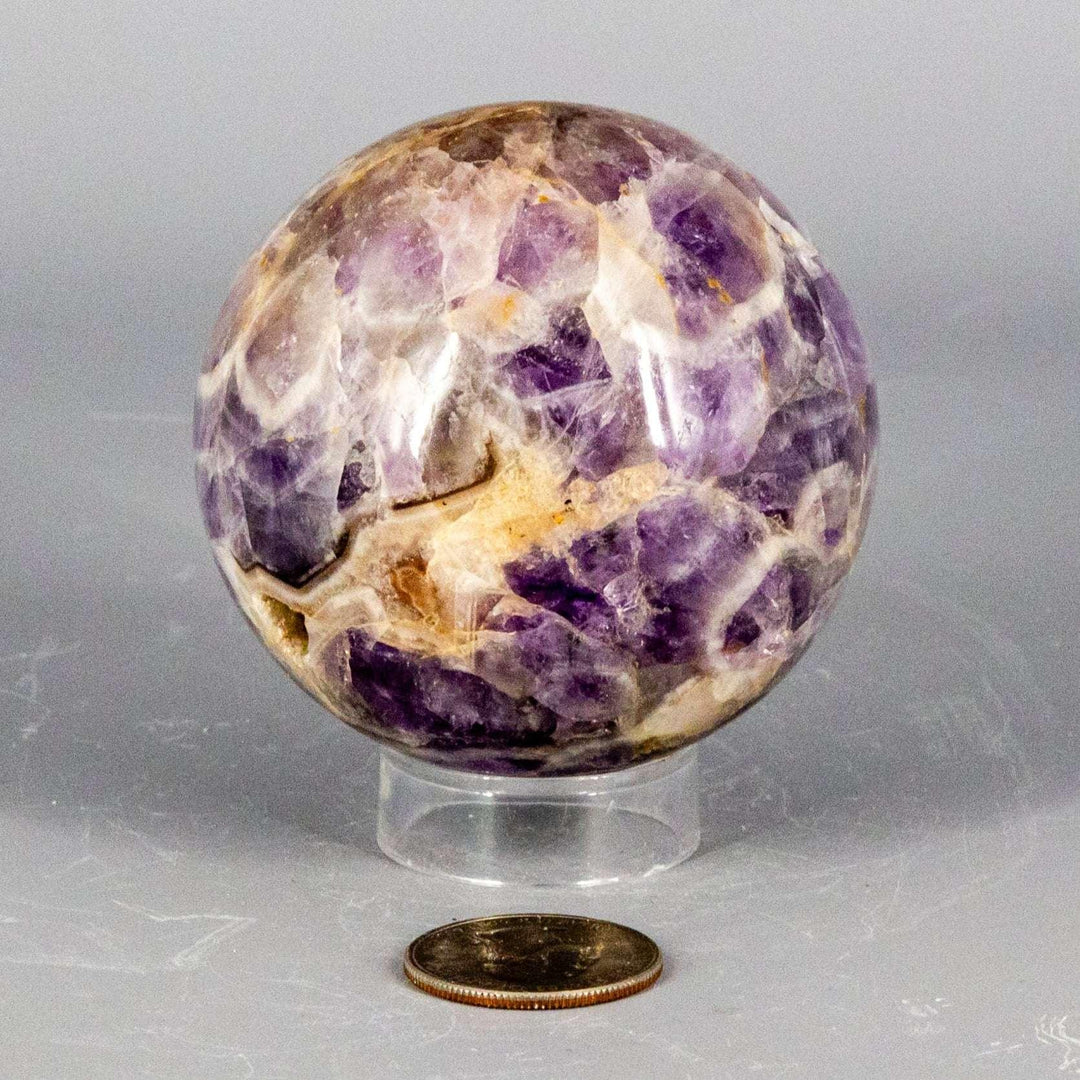 Stunning Amethyst Sphere, 45-72mm, showcasing deep purple to pale lavender hues for calm and spiritual clarity.