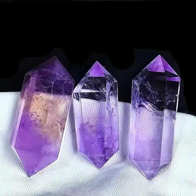 Polished amethyst double-pointed crystal with vibrant violet hues, perfect for crown chakra meditation and reflection.
