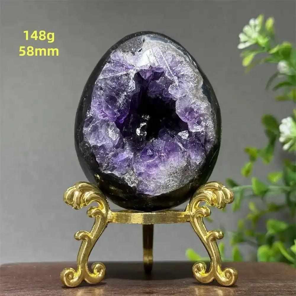 Amethyst geode dinosaur egg with sparkling purple crystals in a polished shell, perfect for meditation and calm.