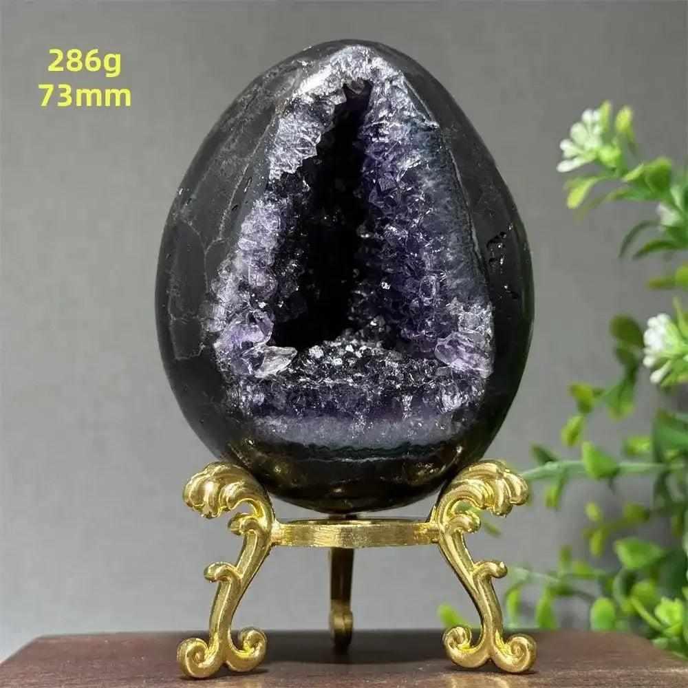 Amethyst geode dinosaur egg with sparkling purple crystals for Crown Chakra healing and peaceful meditation.