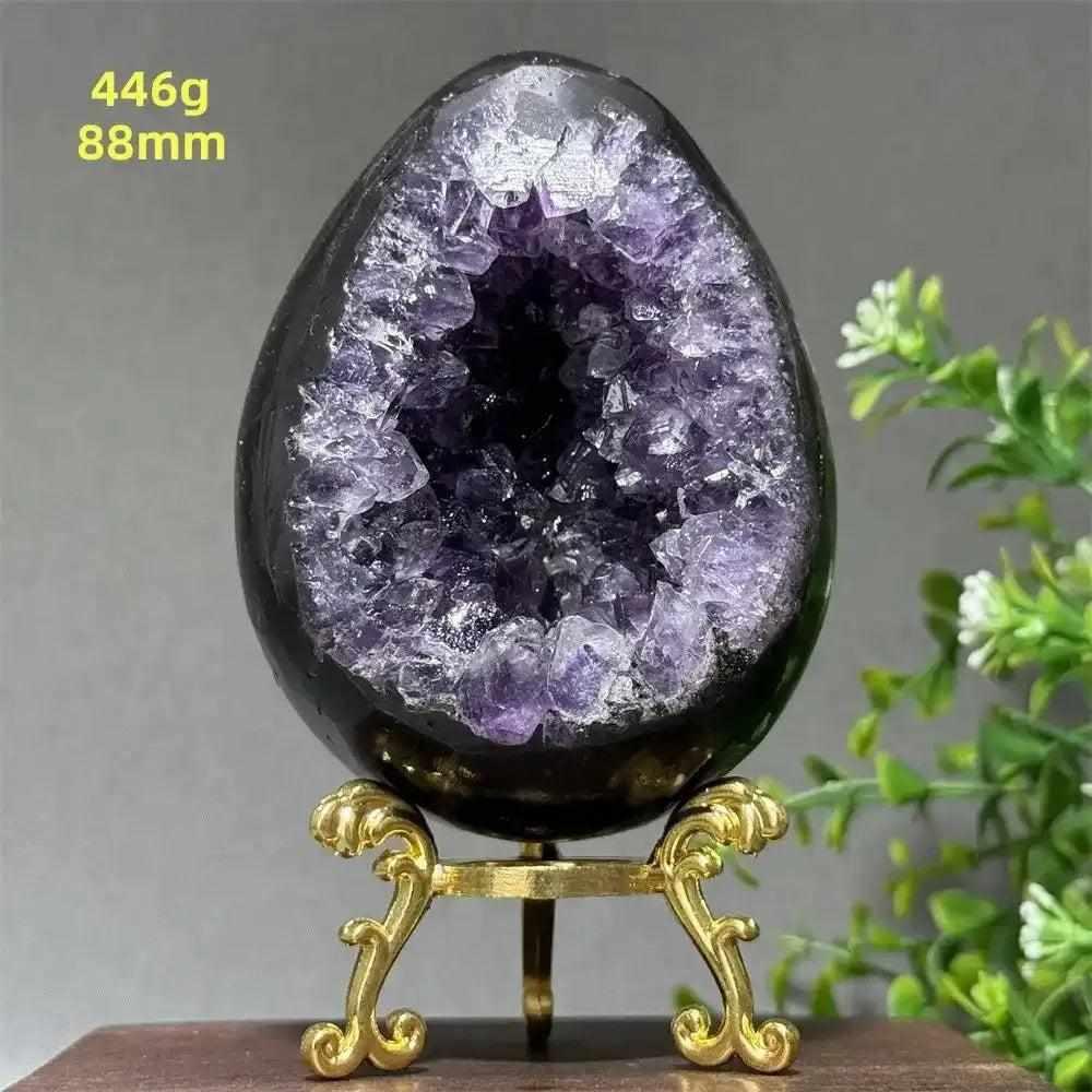 Amethyst geode dinosaur egg with sparkling purple crystals in a polished shell, perfect for meditation and calm.