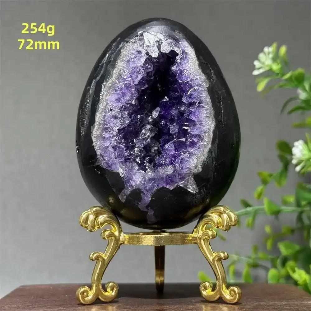 Amethyst geode dinosaur egg with sparkling purple crystals in a polished shell, perfect for meditation and calm.
