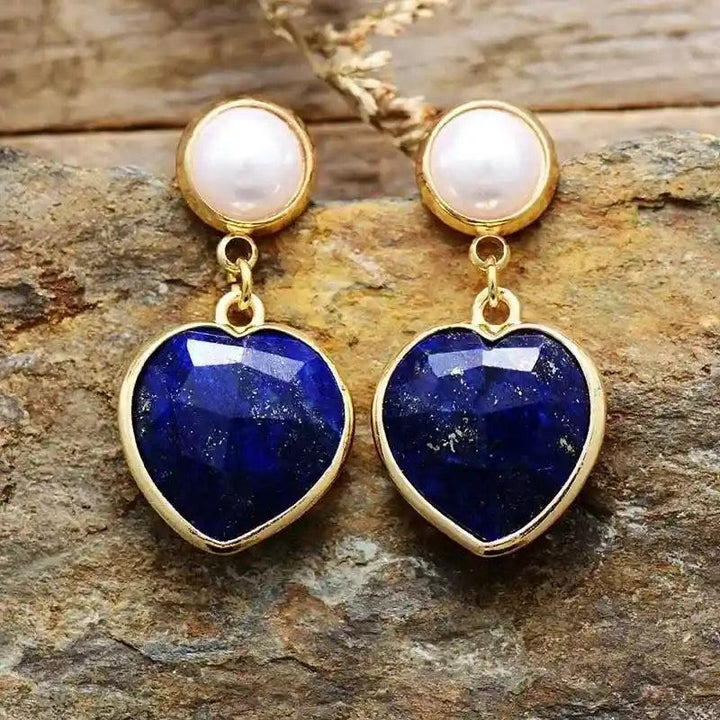Lapis Lazuli Heart Stud Earrings with white pearl tops and gold settings, offering spiritual clarity and deep intuition.