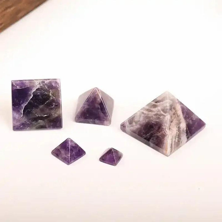 Hand-polished Amethyst Mini Pyramids in varying sizes, featuring rich purple hues for Crown and Third Eye chakra healing.