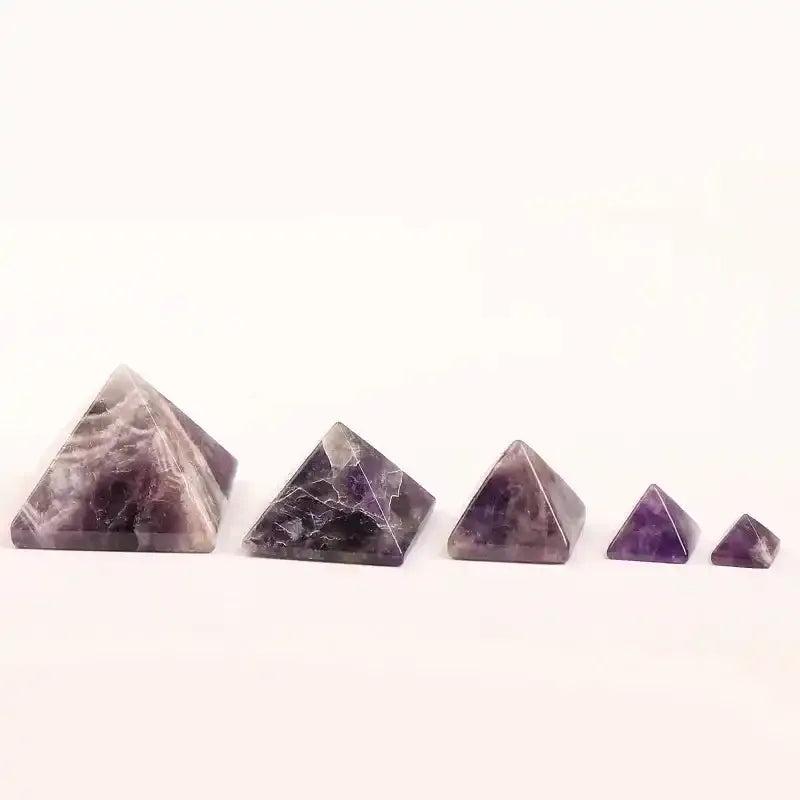 Hand-polished Amethyst Mini Pyramids in varying sizes, featuring rich purple hues and natural quartz patterns.