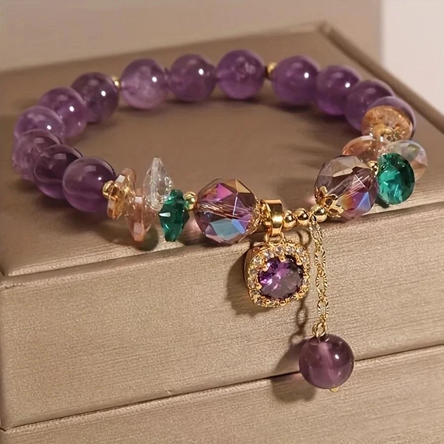 Amethyst Natural Stone Bead Bracelet for Calm and Healing, featuring deep purple beads, faceted crystals, and a gold charm.
