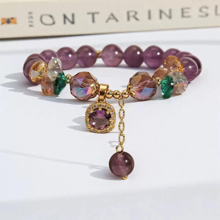 Amethyst Natural Stone Bead Bracelet for Calm and Healing, featuring deep purple beads, faceted crystals, and a gold charm.