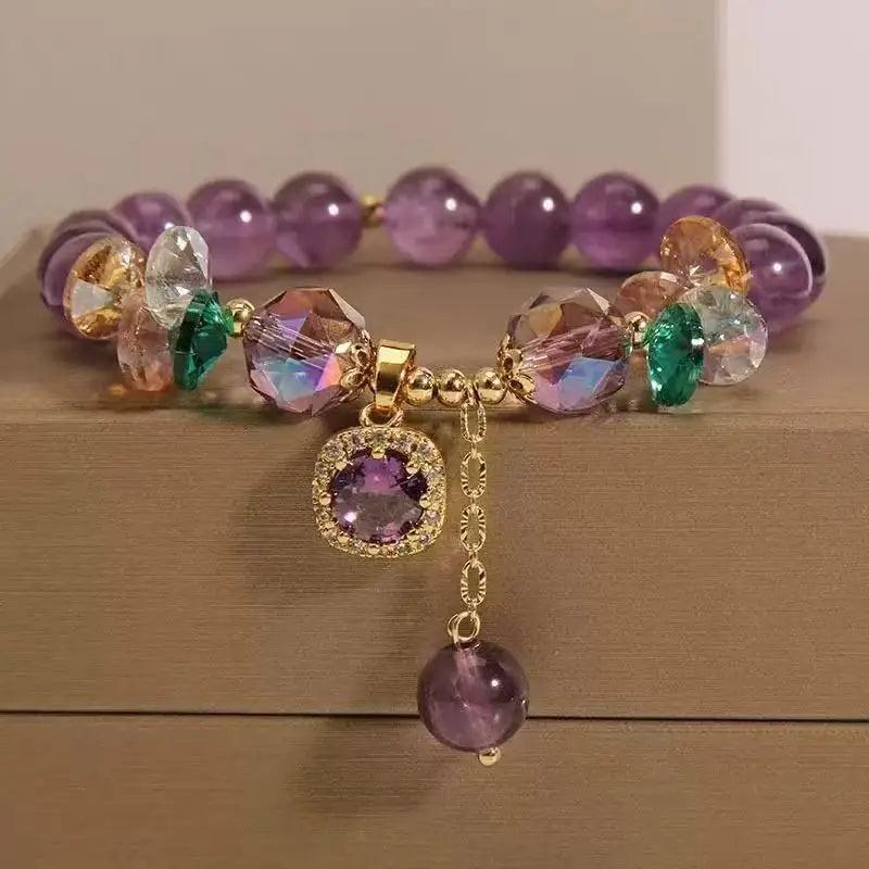 Amethyst Natural Stone Bead Bracelet for Calm and Healing, featuring deep purple beads, faceted crystals, and a gold charm.