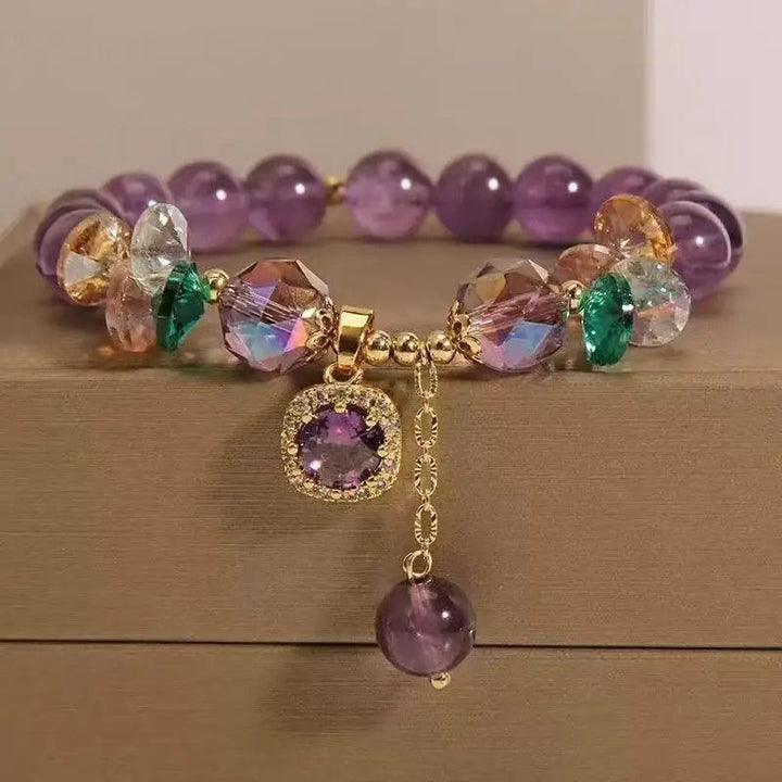 Amethyst Natural Stone Bead Bracelet for Calm and Healing, featuring deep purple beads, faceted crystals, and a gold charm.