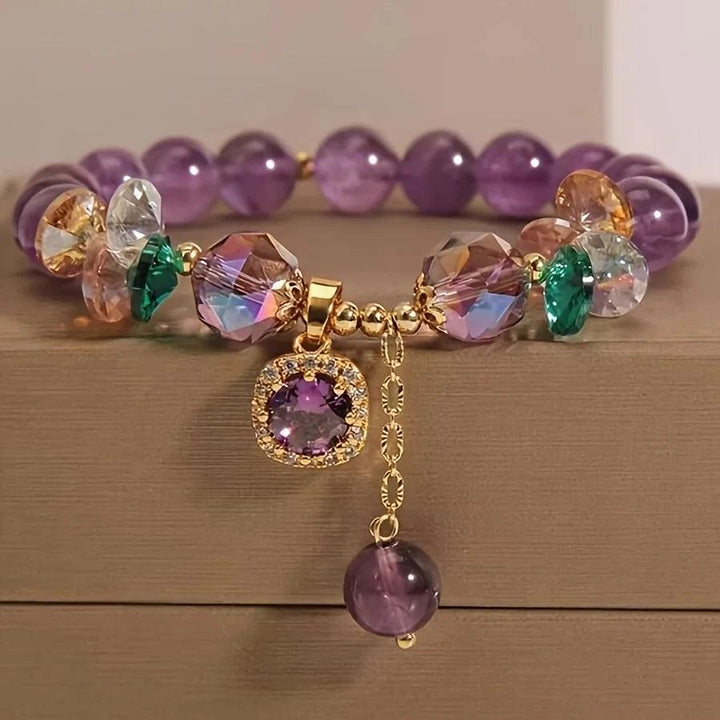 Amethyst Natural Stone Bead Bracelet for Calm and Healing, featuring deep purple beads, faceted crystals, and a gold charm.