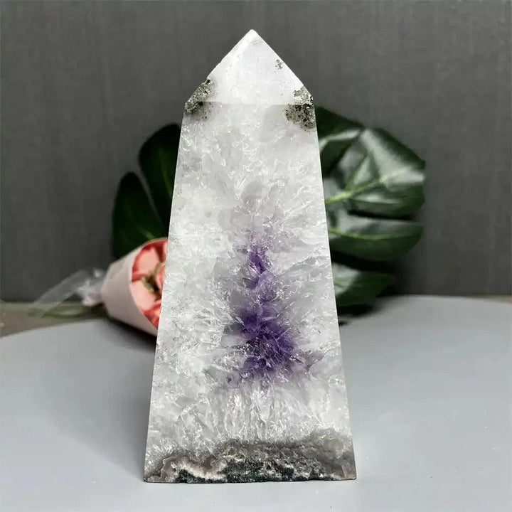 476g Amethyst and Quartz crystal geode tower with a polished pointed top and a stunning purple crown chakra cavity.