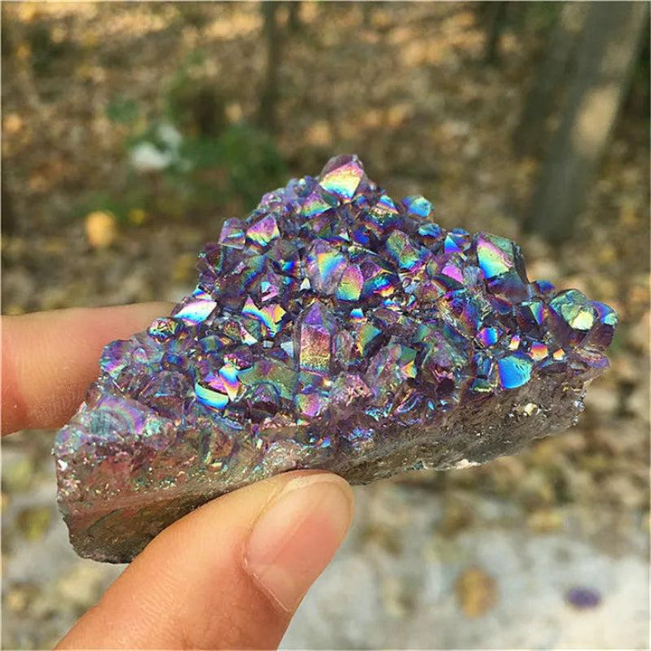 Natural Aura Amethyst crystal cluster with iridescent titanium coating for vibrant reiki healing and home decor.
