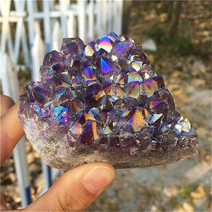 Natural Aura Amethyst crystal cluster with iridescent titanium coating for vibrant rainbow healing and home decor.