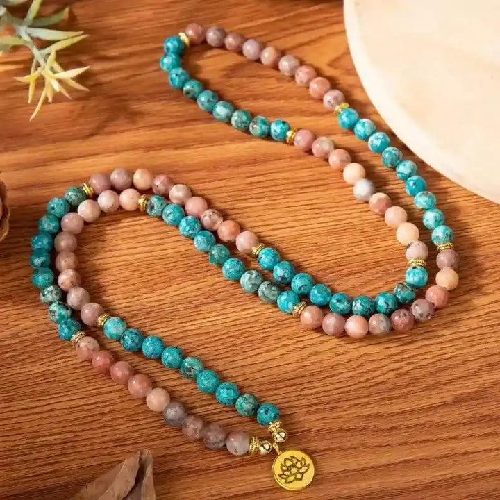 Handcrafted 108 Beads Apatite Mala Bracelet-Necklace with vibrant blue and pink apatite beads, gold accents, and a lotus charm.