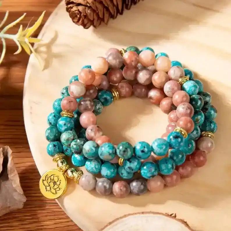 Handcrafted 108 Beads Apatite Mala Bracelet-Necklace with vibrant blue-green apatite and peach beads, gold accents, and lotus charm.