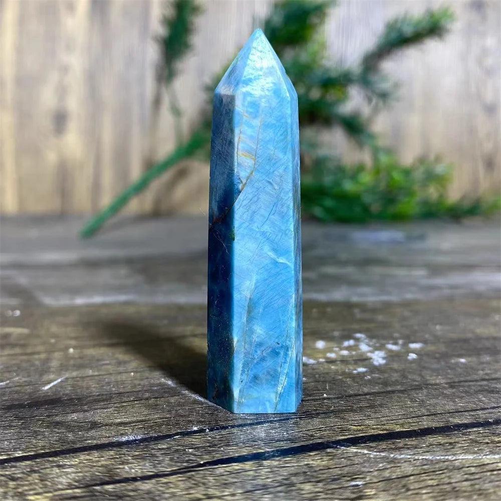 Polished blue Apatite crystal tower wand for healing, featuring natural mineral textures and a vibrant gemstone point.