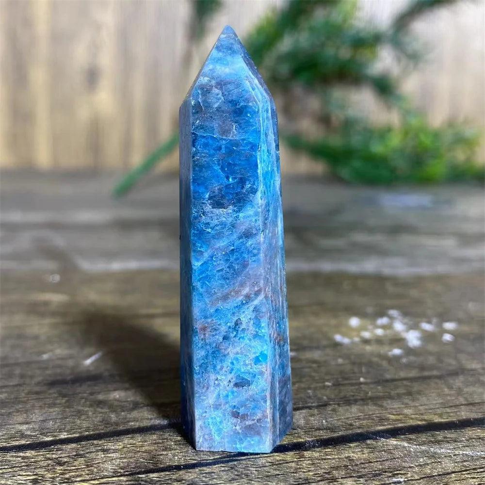 Natural blue apatite crystal tower wand for healing, featuring a polished gemstone point with vibrant mineral textures.