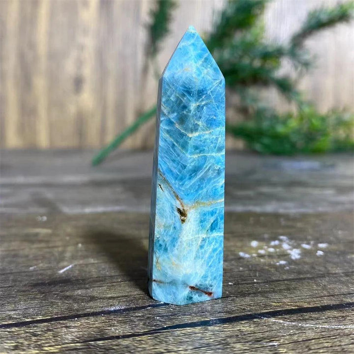 Natural blue apatite crystal tower wand for healing, featuring vibrant azure tones and unique mineral inclusions.
