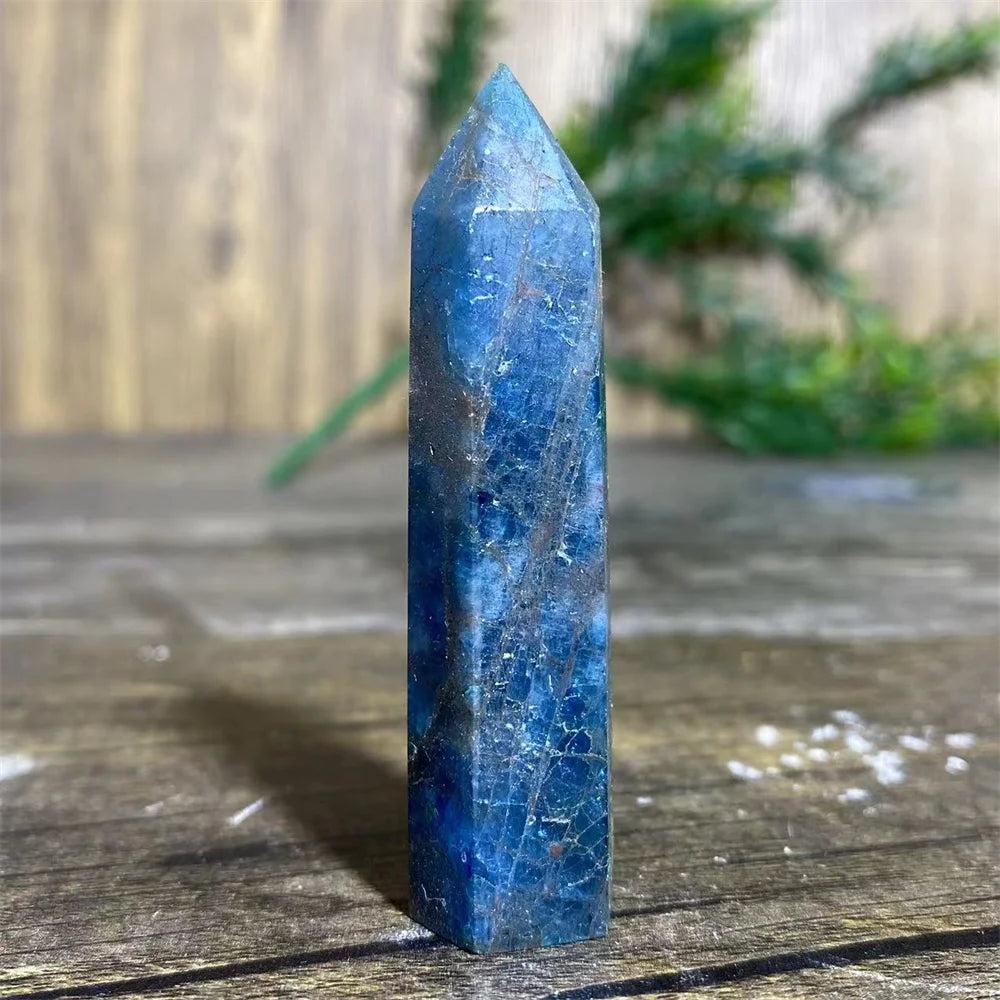 Natural blue apatite crystal tower wand for healing, featuring deep indigo tones and unique mineral textures.
