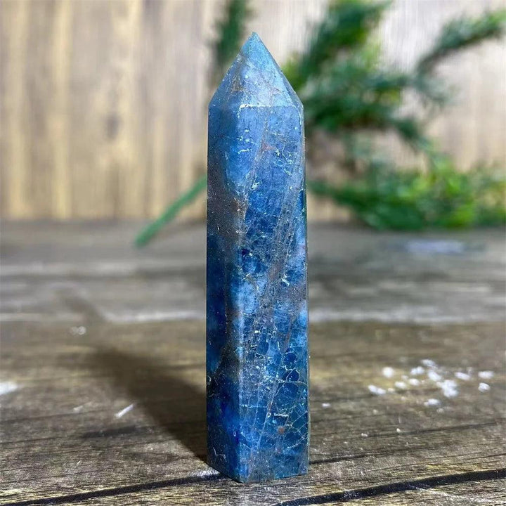 Natural blue apatite crystal tower wand for healing, featuring deep indigo tones and unique mineral textures.