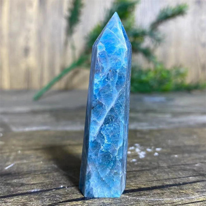 Polished blue apatite crystal tower wand for healing, featuring vibrant natural stone textures for spiritual decor.