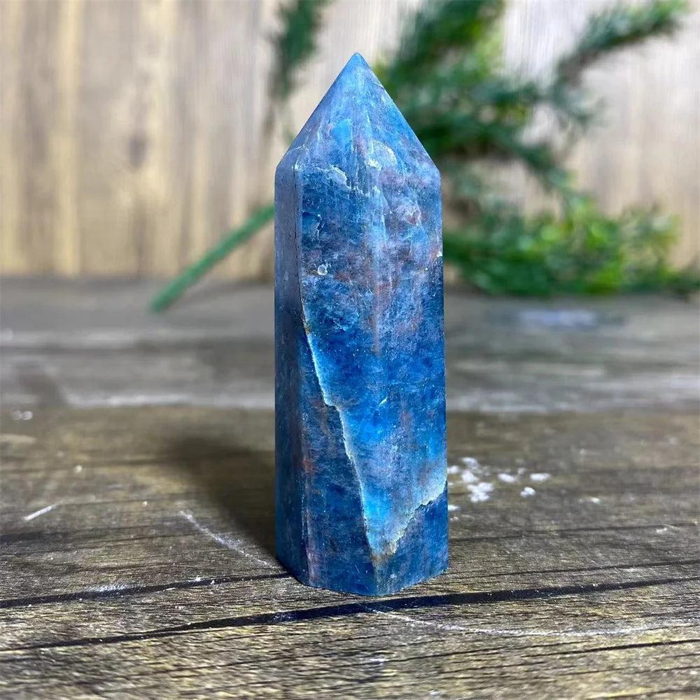 Natural blue apatite crystal tower wand for healing, featuring deep azure tones and a polished geometric point design.