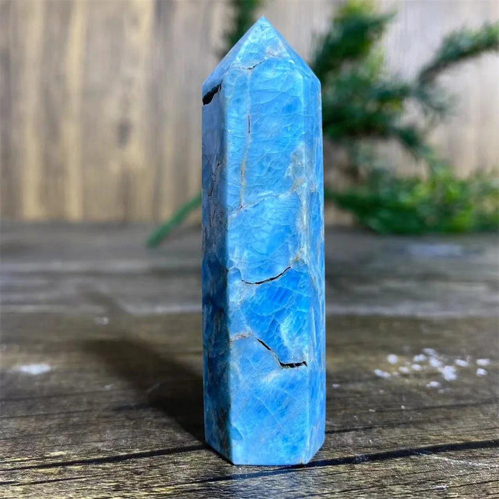 Natural blue apatite crystal tower wand for Reiki healing, featuring a vibrant polished gemstone point for home decor.