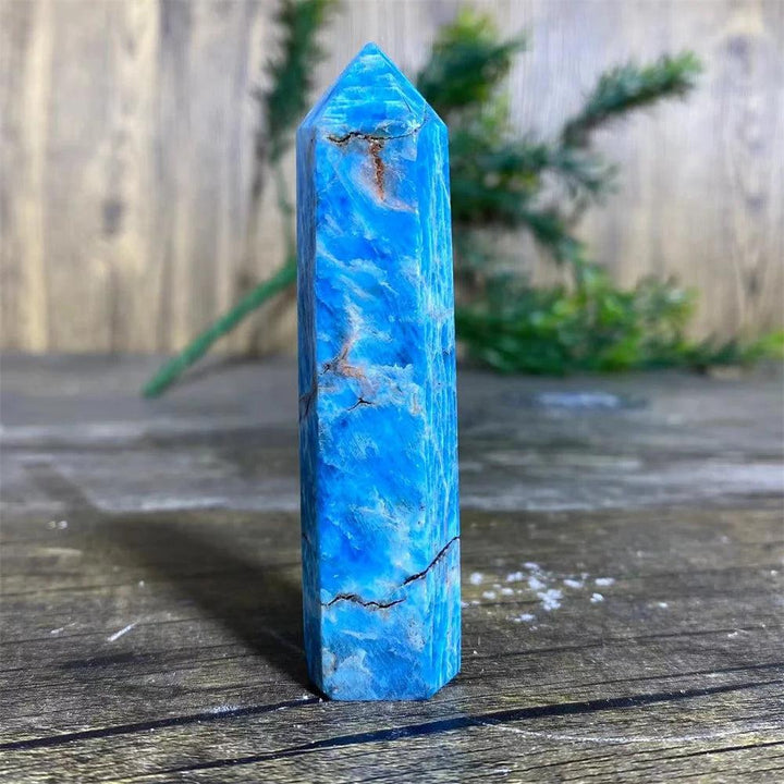 Vibrant blue natural Apatite crystal tower wand, a polished healing gemstone point perfect for Reiki and home decor.