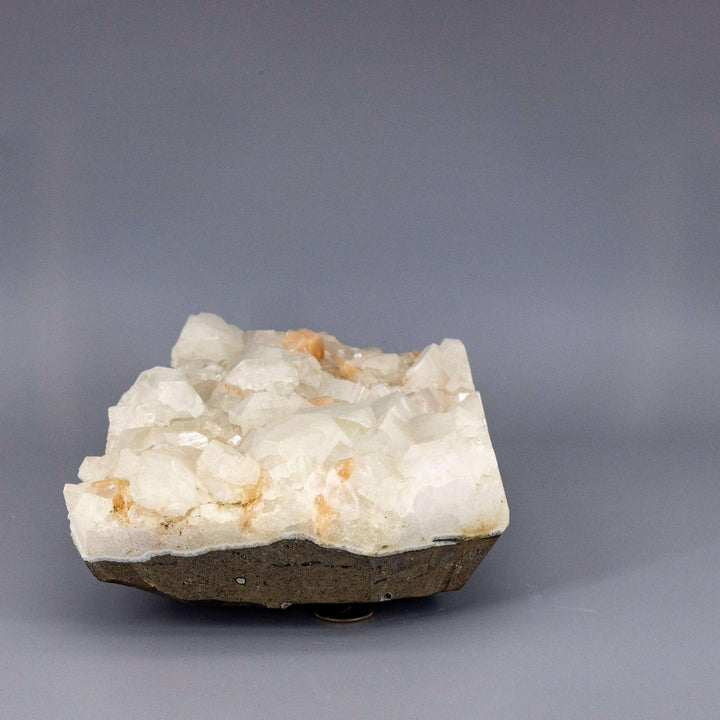XXL Apophyllite with "peach" Stilbite cluster: tall, clear crystals with soft, peachy-pink fan formations.
