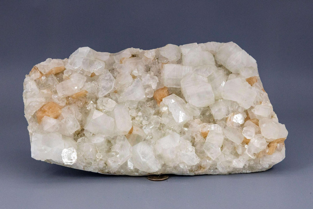 XXL Apophyllite with "peach" Stilbite cluster, showcasing clear, pyramid-tipped crystals and soft, peachy-pink formations.