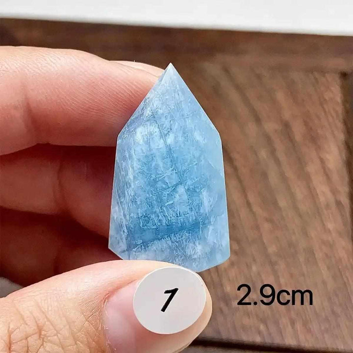 Hand-polished Aquamarine Mini Tower with sea-blue hues and natural inclusions, perfect for Throat Chakra healing.