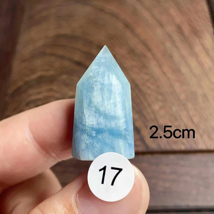 Hand-polished Aquamarine Mini Tower, piece 17, featuring a sea-blue faceted point for calm communication and energy.