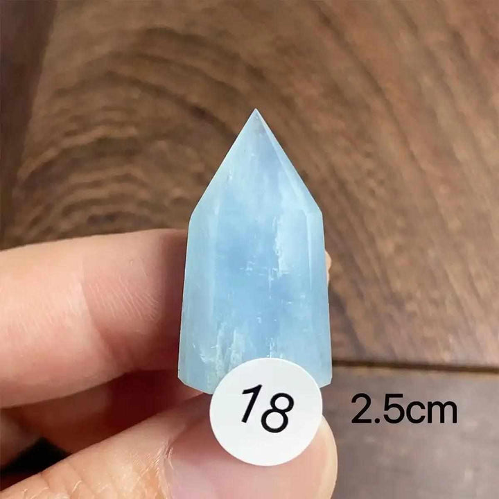 Hand-polished Aquamarine Mini Tower, piece 18, featuring a sea-blue faceted point for calm, clear communication.