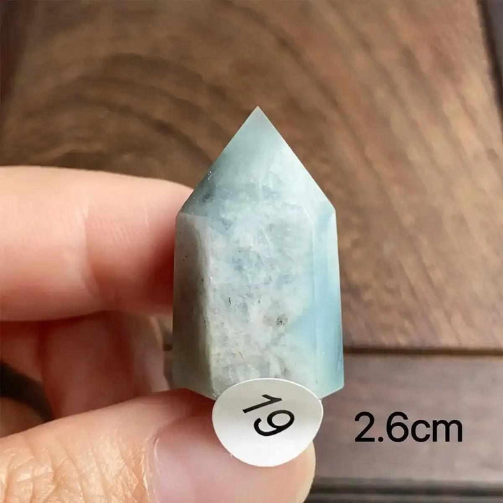 Hand-polished Aquamarine Mini Tower, piece 19, featuring a sea-blue faceted point for calm energy and communication.