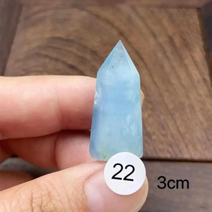 Hand-polished Aquamarine Mini Tower with a faceted point, featuring calming sea-blue tones for meditation and healing.