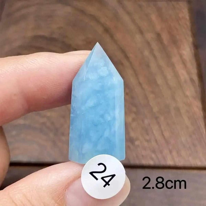 Small Aquamarine Mini Tower crystal with a faceted point, featuring a calming sea-blue color for Throat Chakra healing.