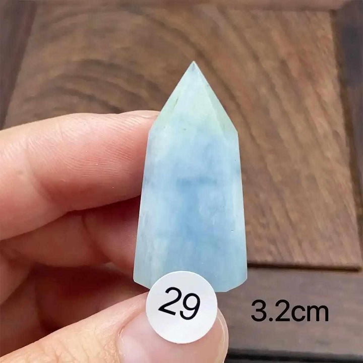 Hand-polished Aquamarine Mini Tower with a faceted point, featuring calming sea-blue tones for meditation and healing.