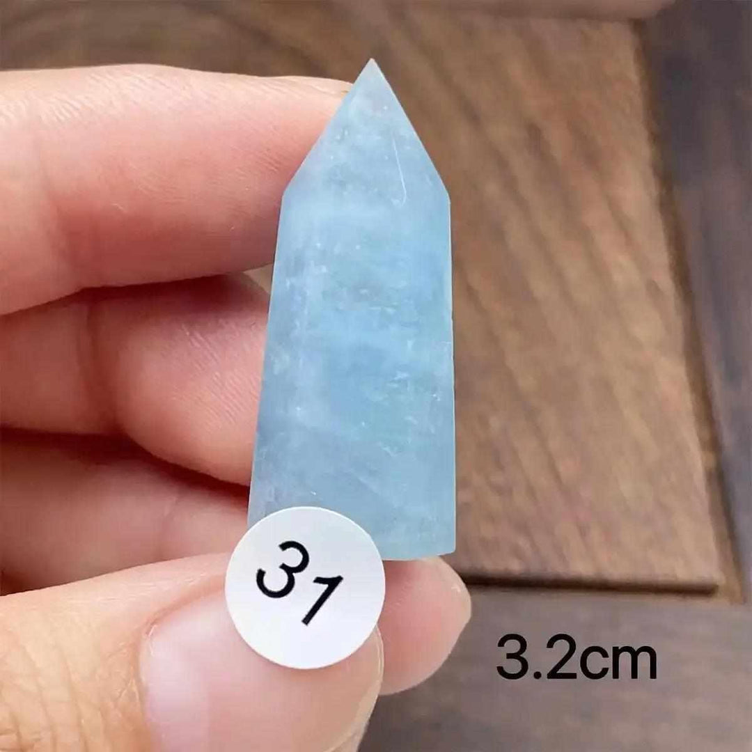 Small Aquamarine Mini Tower, piece 31, featuring a faceted point and calming blue-green hues for energy and communication.