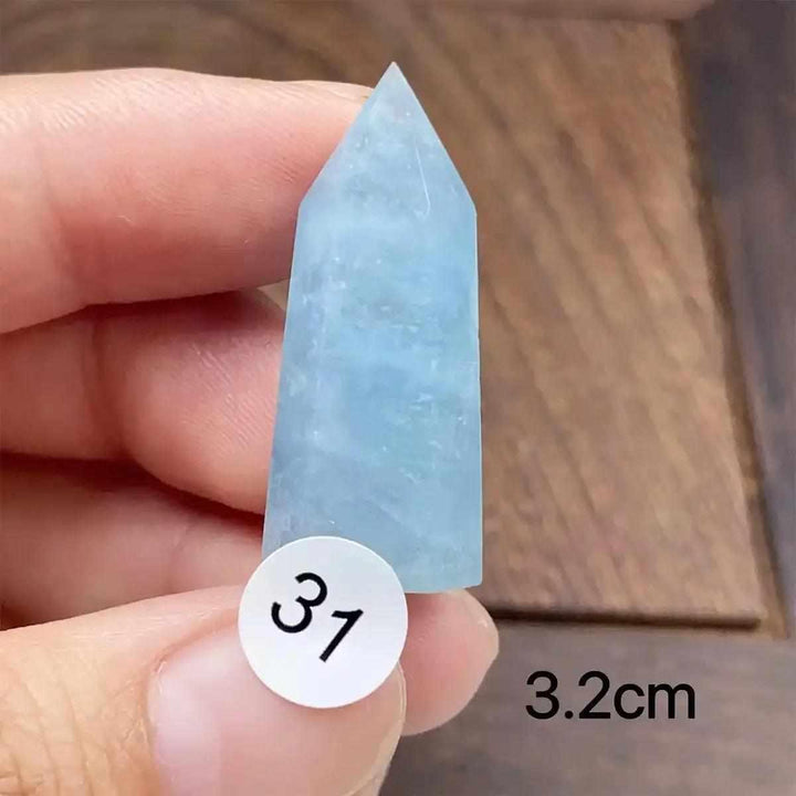 Small Aquamarine Mini Tower, piece 31, featuring a faceted point and calming blue-green hues for energy and communication.