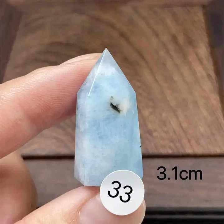 Small Aquamarine Mini Tower crystal with a faceted point, featuring calming sea-blue hues and natural stone inclusions.
