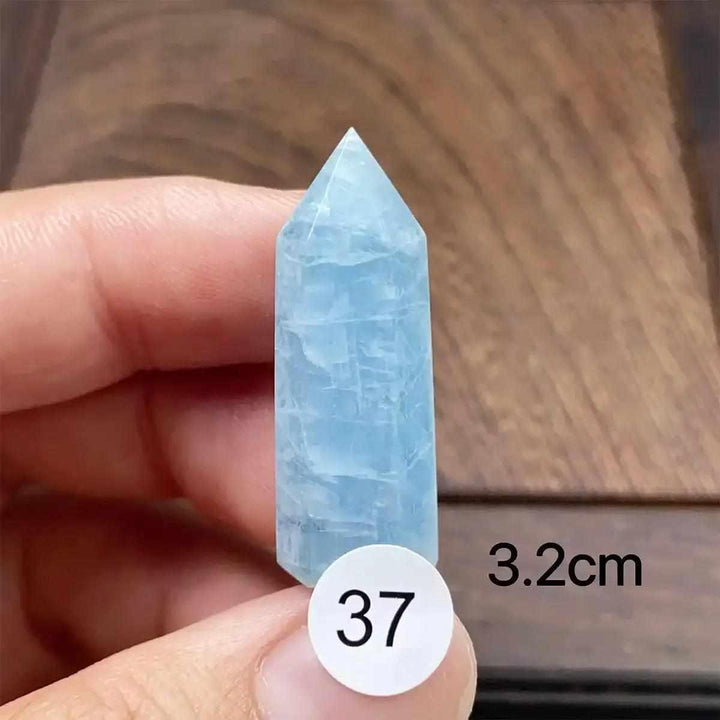 Small Aquamarine Mini Tower with a faceted point, showcasing serene blue tones and natural inclusions for calm energy.