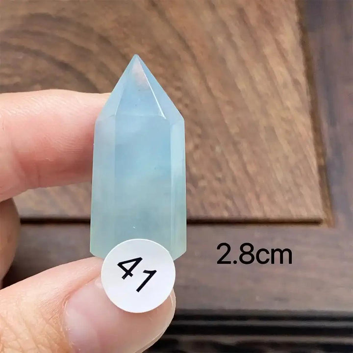 Small Aquamarine Mini Tower with a faceted point, featuring a calming sea-blue hue for throat chakra healing.