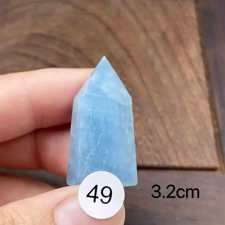 Small Aquamarine Mini Tower with a faceted point, featuring calming sea-blue hues for Throat and Heart chakra healing.