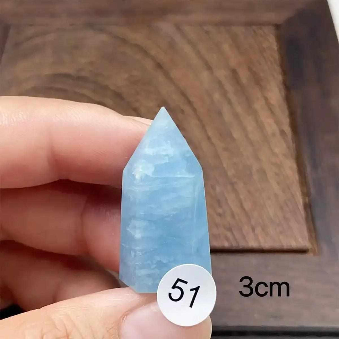 Hand-polished Aquamarine Mini Tower with a faceted point, featuring calming sea-blue tones for meditation and healing.