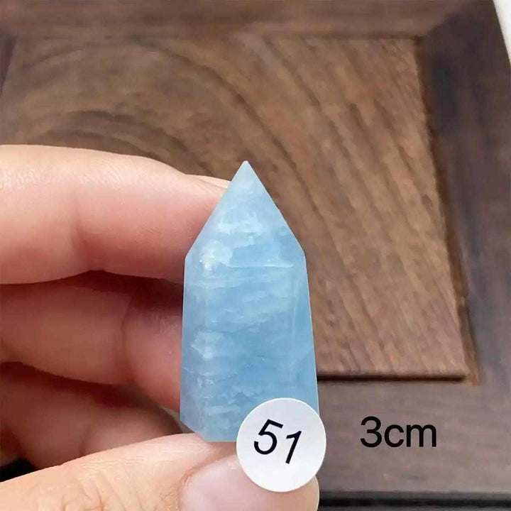 Hand-polished Aquamarine Mini Tower with a faceted point, featuring calming sea-blue tones for meditation and healing.