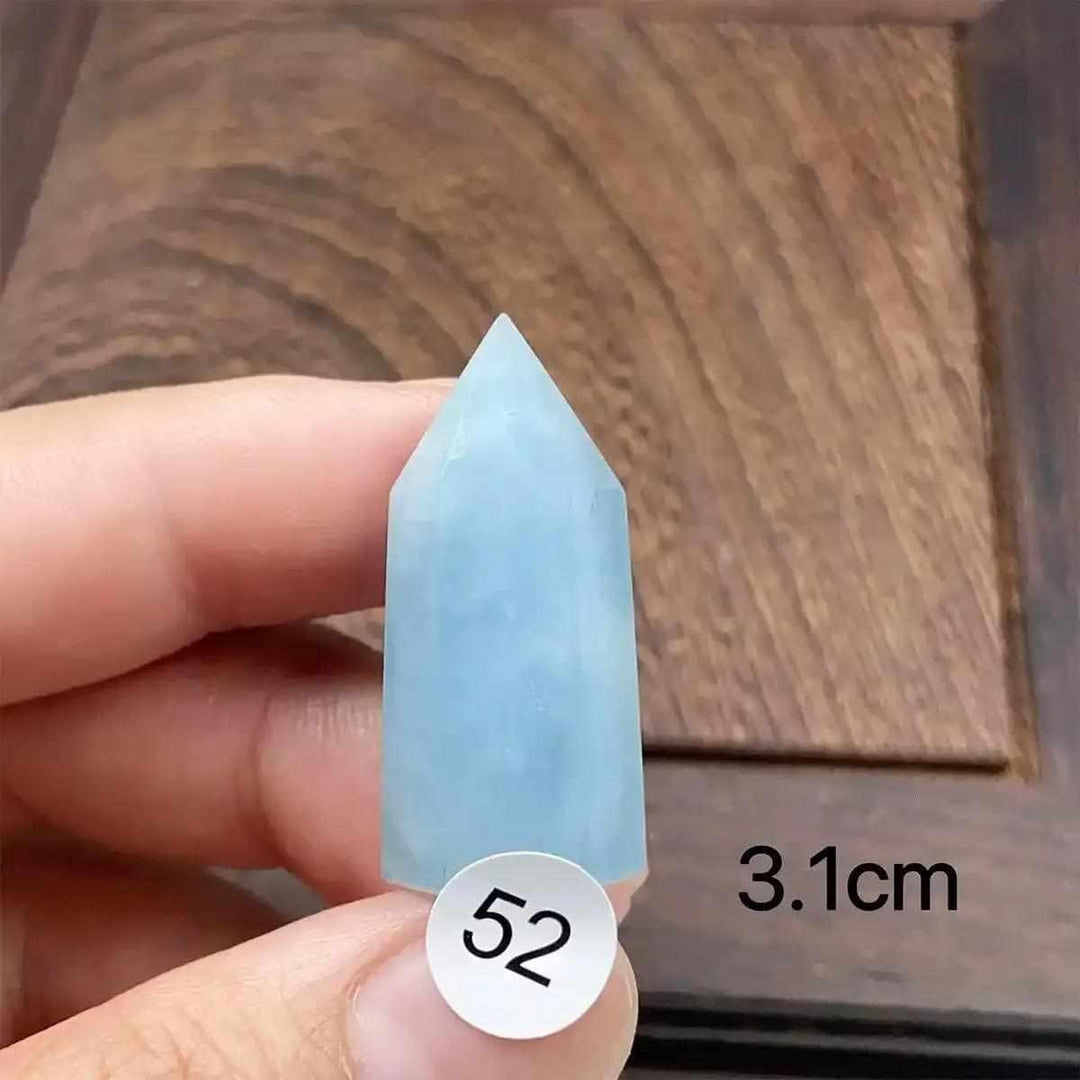 Hand-polished Aquamarine Mini Tower, piece 52, featuring a sea-blue faceted point for calm energy and clear communication.