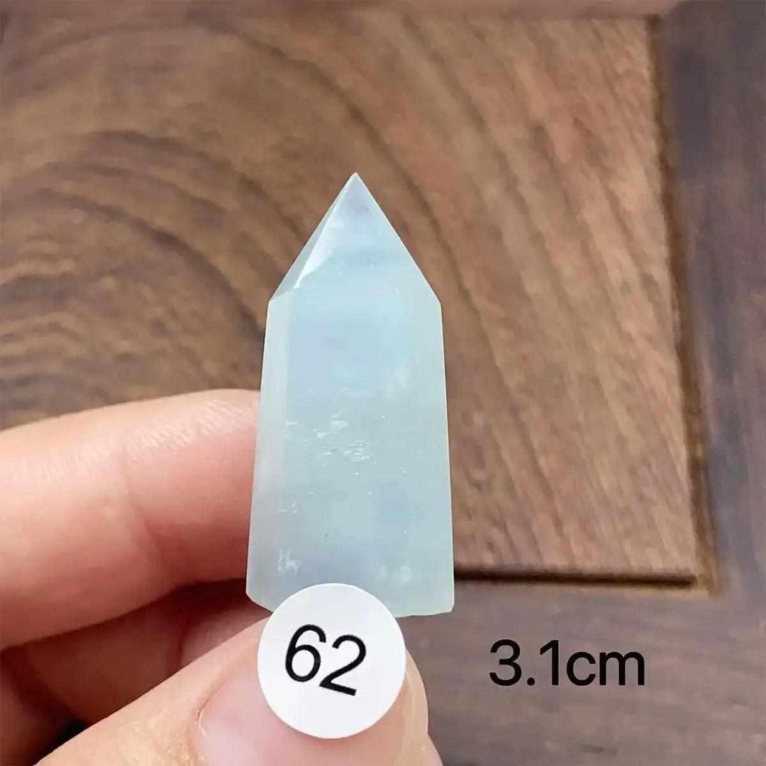 Small Aquamarine Mini Tower, piece 62, featuring a sea-blue faceted point for calm energy and clear communication.