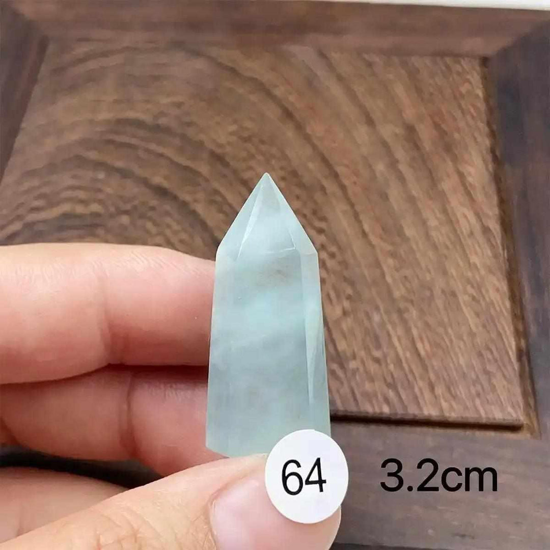 Hand-polished Aquamarine Mini Tower with a faceted point, featuring calming blue-green hues for Throat Chakra healing.