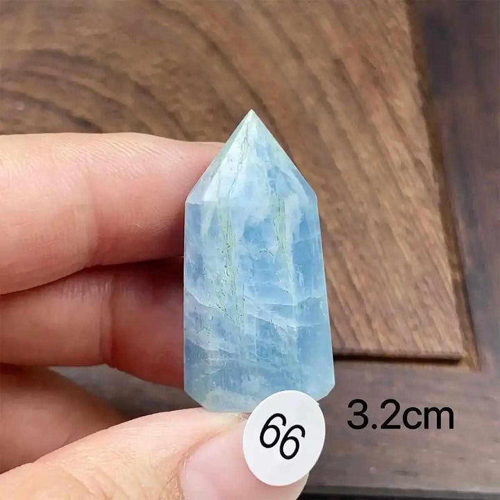 Small Aquamarine Mini Tower crystal with sea-blue hues, faceted point, and natural inclusions for calm communication.